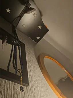 Lapis Lazuli mala hanging on a wall hook