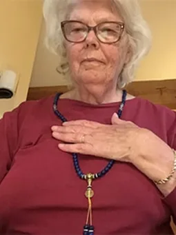 Verified customer wearing her Lapis Lazuli mala, hand over heart