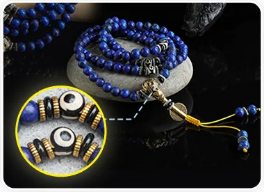 Lapis Lazuli mala bracelet close-up showing the guru bead and tassel