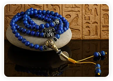 Lapis Lazuli mala necklace displayed on natural stone
