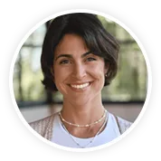 Verified customer smiling while wearing her Lapis Lazuli mala